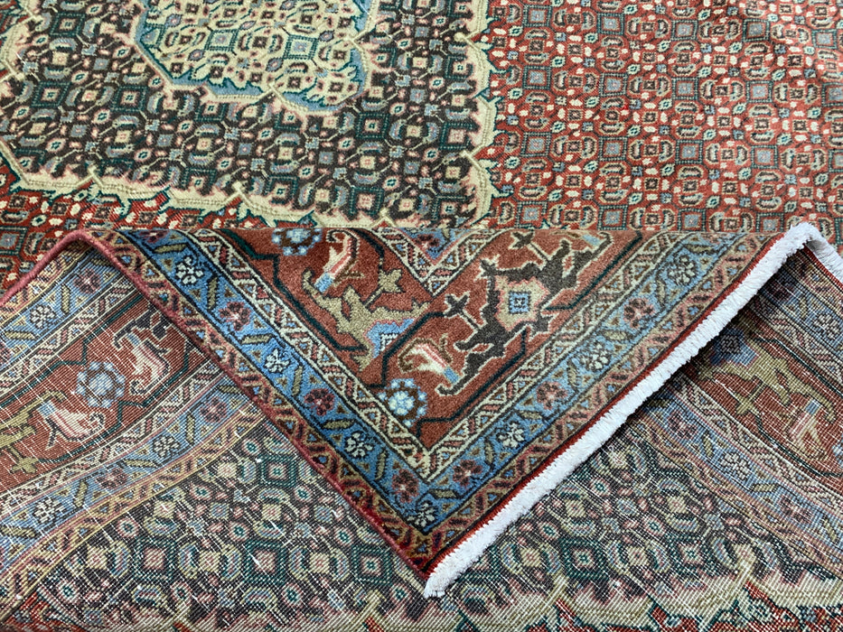 6’5” × 9’4” Hand-Knotted Wool Rug – Rust Red with Teal Diamond Medallion & Animal Border