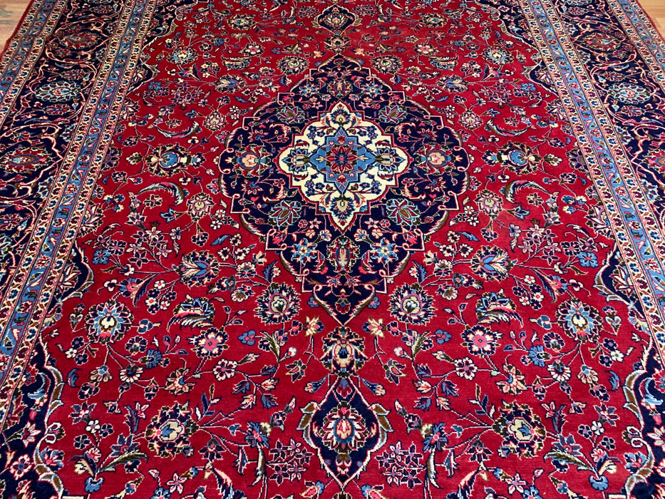 9’6” × 13’11” Hand-Knotted Wool Persian Rug – Red with Navy Border & Central Medallion