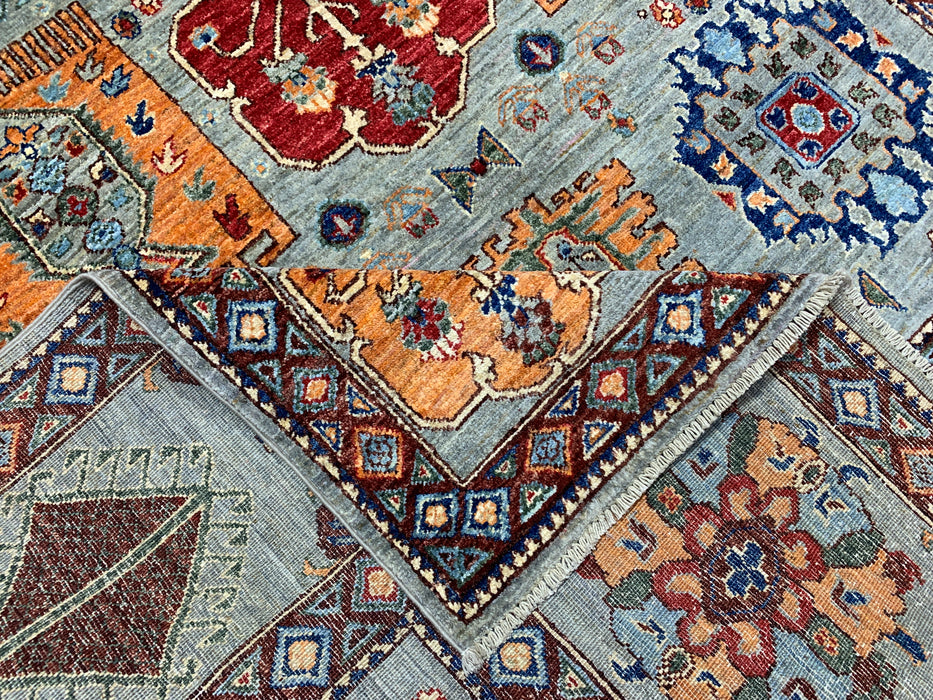 6'3" x 9'7" Hand-Knotted Kazak Wool Rug – Aqua Blue with Multicolor Tribal Motifs