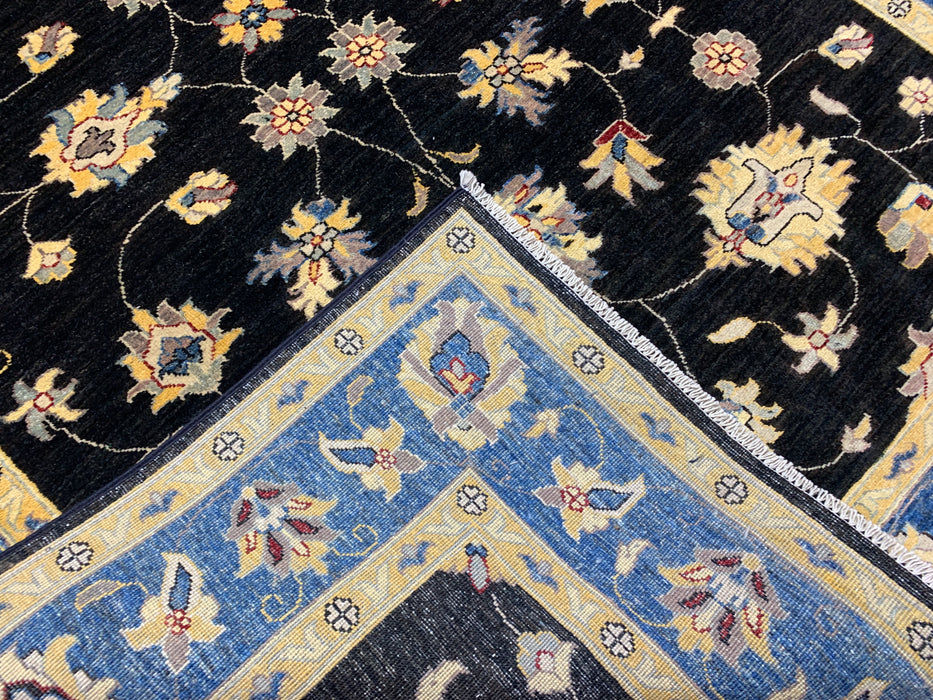 5'7" × 7'8" Hand-Knotted Wool Rug – Black Field with Blue & Gold Floral Border
