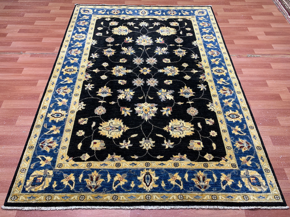 5'7" × 7'8" Hand-Knotted Wool Rug – Black Field with Blue & Gold Floral Border
