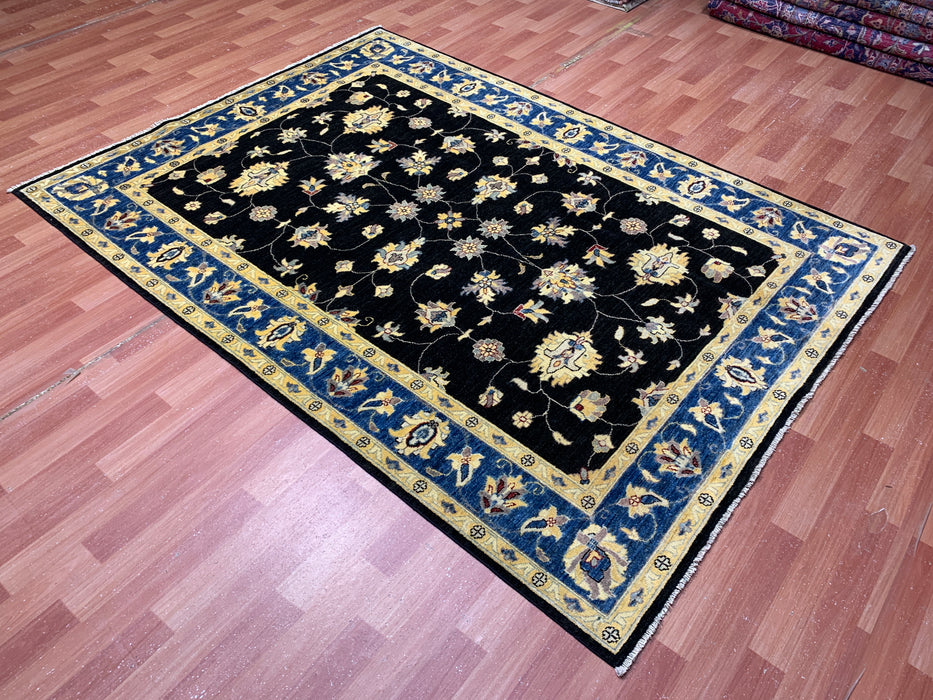 5'7" × 7'8" Hand-Knotted Wool Rug – Black Field with Blue & Gold Floral Border