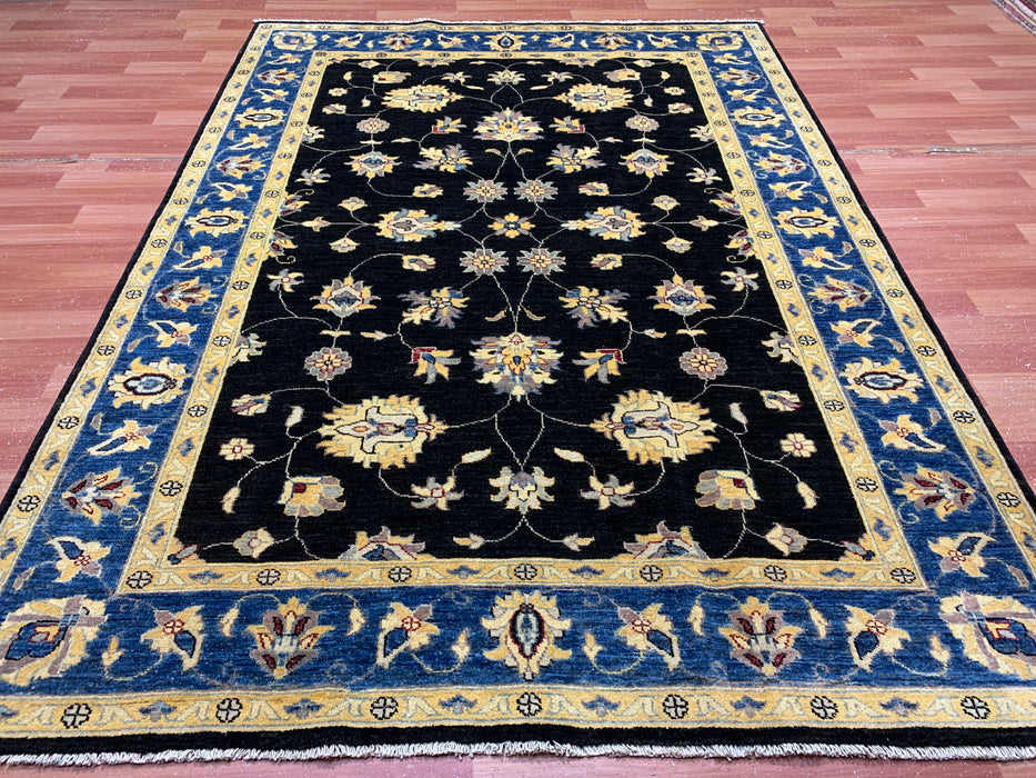 5'7" × 7'8" Hand-Knotted Wool Rug – Black Field with Blue & Gold Floral Border