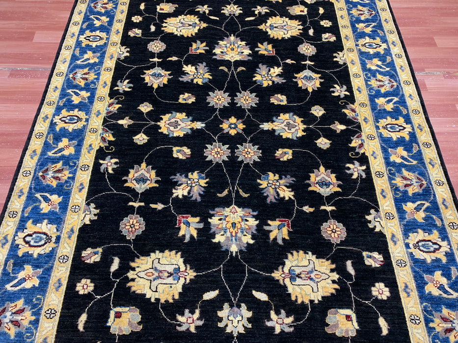5'7" × 7'8" Hand-Knotted Wool Rug – Black Field with Blue & Gold Floral Border