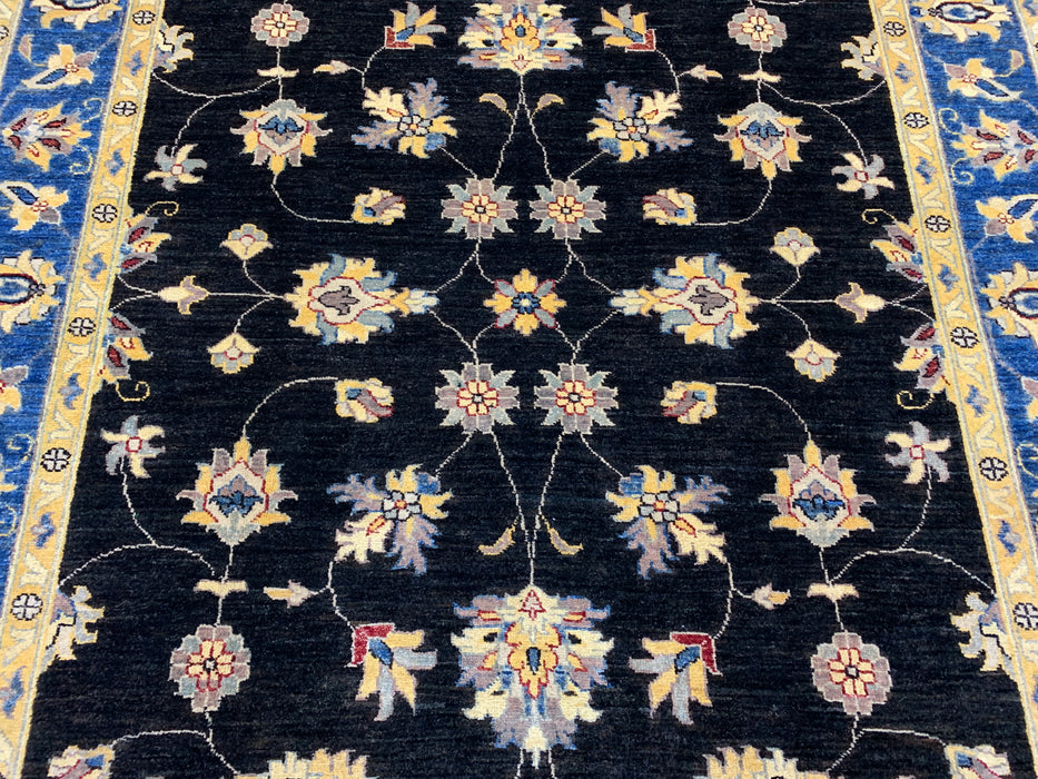 5'7" × 7'8" Hand-Knotted Wool Rug – Black Field with Blue & Gold Floral Border