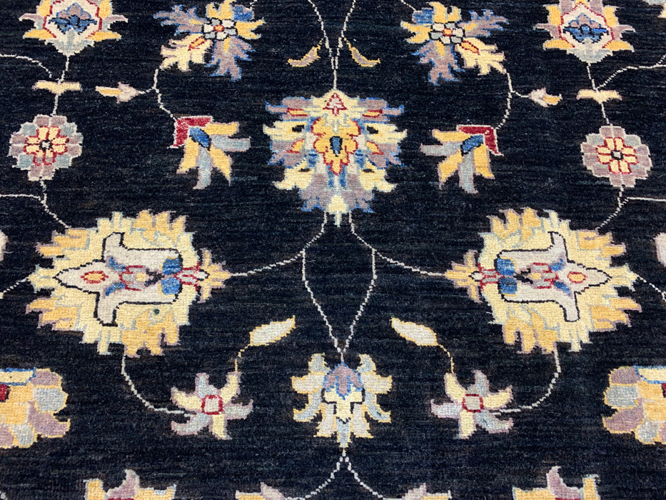 5'7" × 7'8" Hand-Knotted Wool Rug – Black Field with Blue & Gold Floral Border