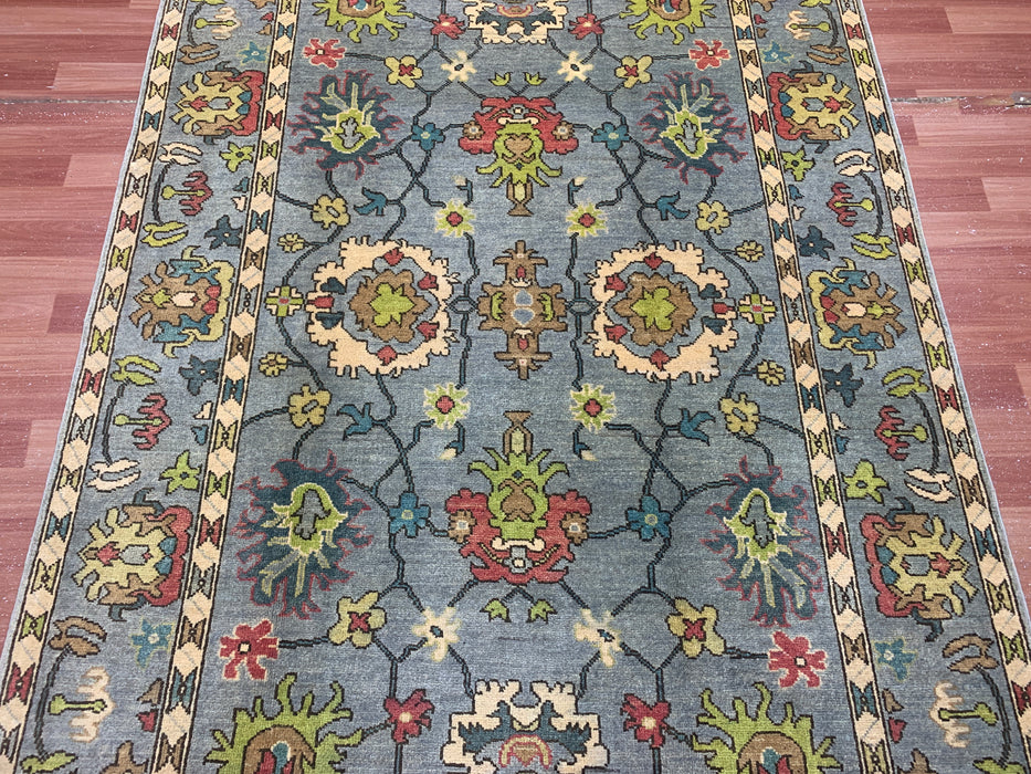 4'10" × 6'8" Hand-Knotted Ziegler Wool Rug – Soft Blue with Multicolor Floral Motifs