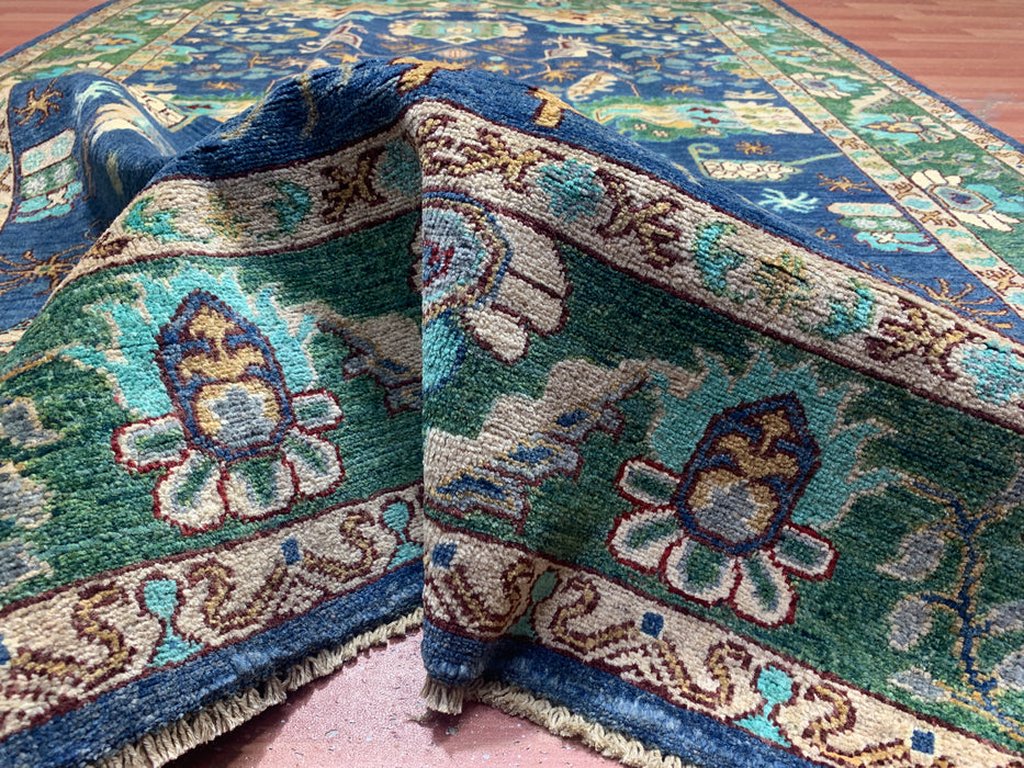 5'0" × 7'10" Hand-Knotted Tribal Wool Rug – Navy Blue with Green & Ivory Border