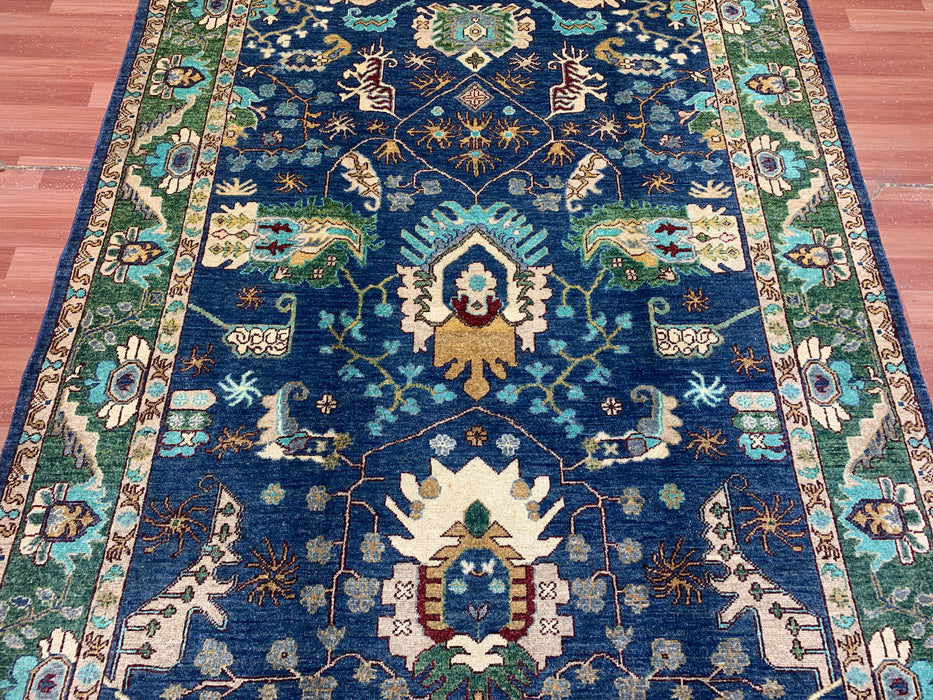 5'0" × 7'10" Hand-Knotted Tribal Wool Rug – Navy Blue with Green & Ivory Border