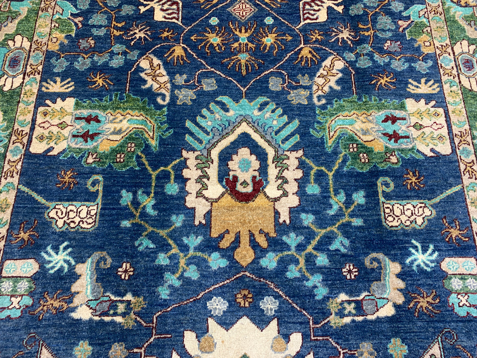 5'0" × 7'10" Hand-Knotted Tribal Wool Rug – Navy Blue with Green & Ivory Border