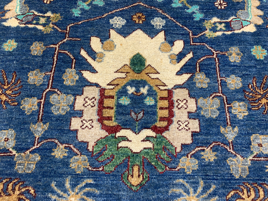 5'0" × 7'10" Hand-Knotted Tribal Wool Rug – Navy Blue with Green & Ivory Border