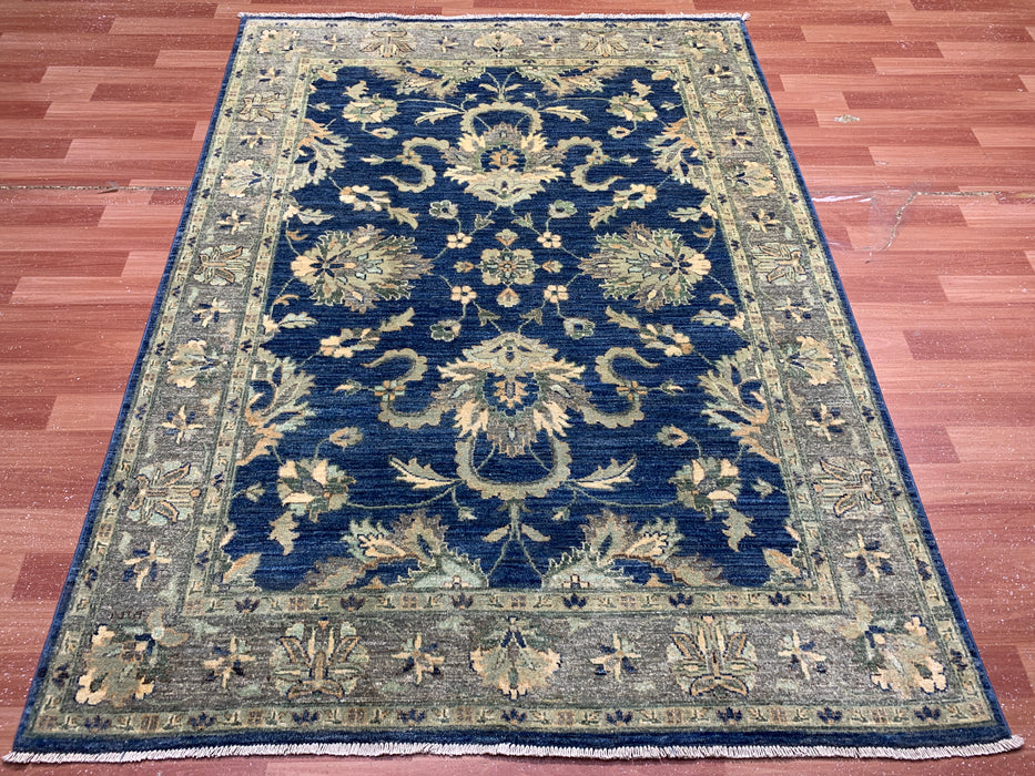 4'10" × 6'6" Hand-Knotted Wool Rug – Navy with Soft Beige & Sage Floral Border