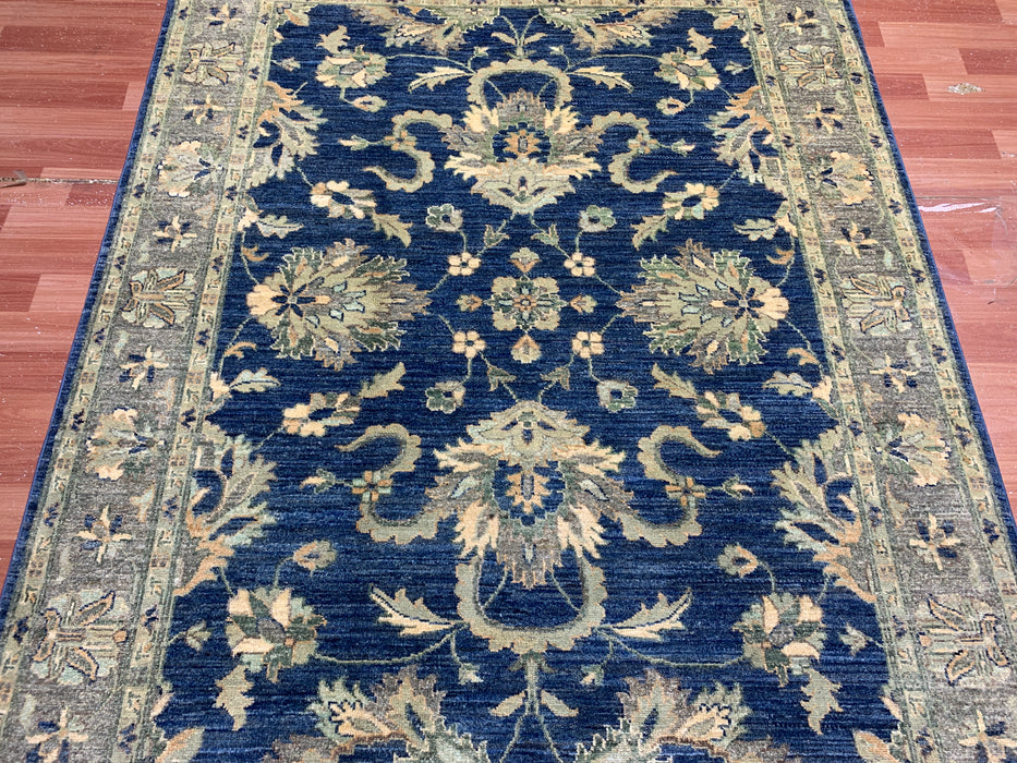 4'10" × 6'6" Hand-Knotted Wool Rug – Navy with Soft Beige & Sage Floral Border