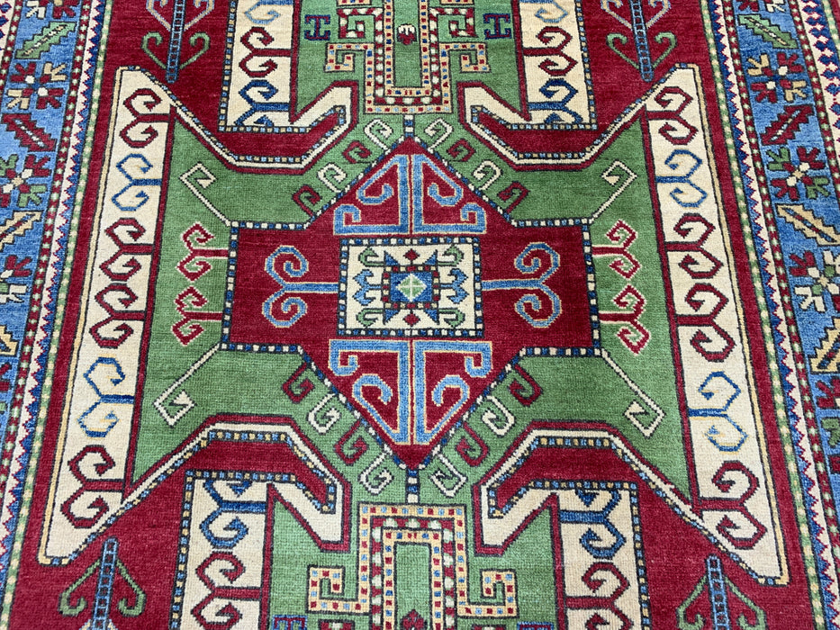 4'10" × 6'7" Hand-Knotted Kazak Wool Rug – Red, Green & Blue Geometric Tribal Design