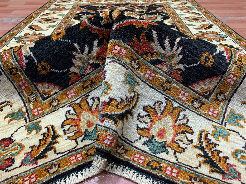 3'11" × 5'10" Hand-Knotted Wool Rug – Black Field with Ivory Border & Floral Design