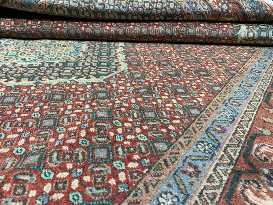 6’5” × 9’4” Hand-Knotted Wool Rug – Rust Red with Teal Diamond Medallion & Animal Border