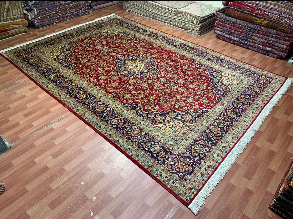 9’6” × 13’10” Hand-Knotted Persian Wool Rug – Red Field with Navy & Ivory Floral Border