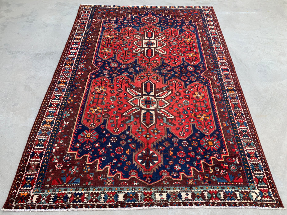 Handmade Persian Wool Area Rug 7x10 - Red Geometric Medallion Persian Style Rug with Navy Field - Exact Size 10'0" x 6'11" - KBHM-828