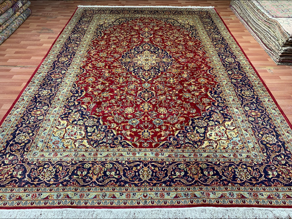 9’6” × 13’10” Hand-Knotted Persian Wool Rug – Red Field with Navy & Ivory Floral Border