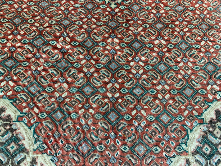 6’5” × 9’4” Hand-Knotted Wool Rug – Rust Red with Teal Diamond Medallion & Animal Border