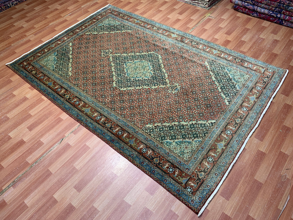 6’5” × 9’4” Hand-Knotted Wool Rug – Rust Red with Teal Diamond Medallion & Animal Border