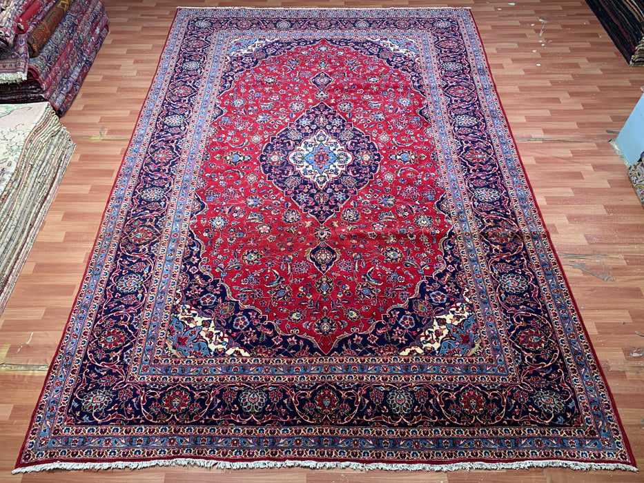 9’6” × 13’11” Hand-Knotted Wool Persian Rug – Red with Navy Border & Central Medallion