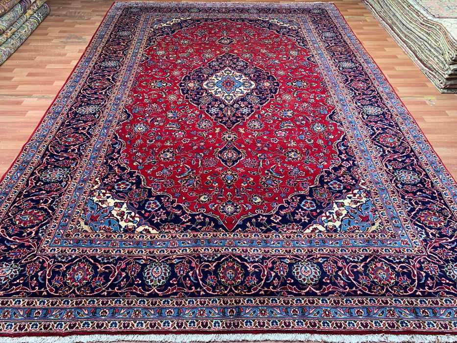 9’6” × 13’11” Hand-Knotted Wool Persian Rug – Red with Navy Border & Central Medallion