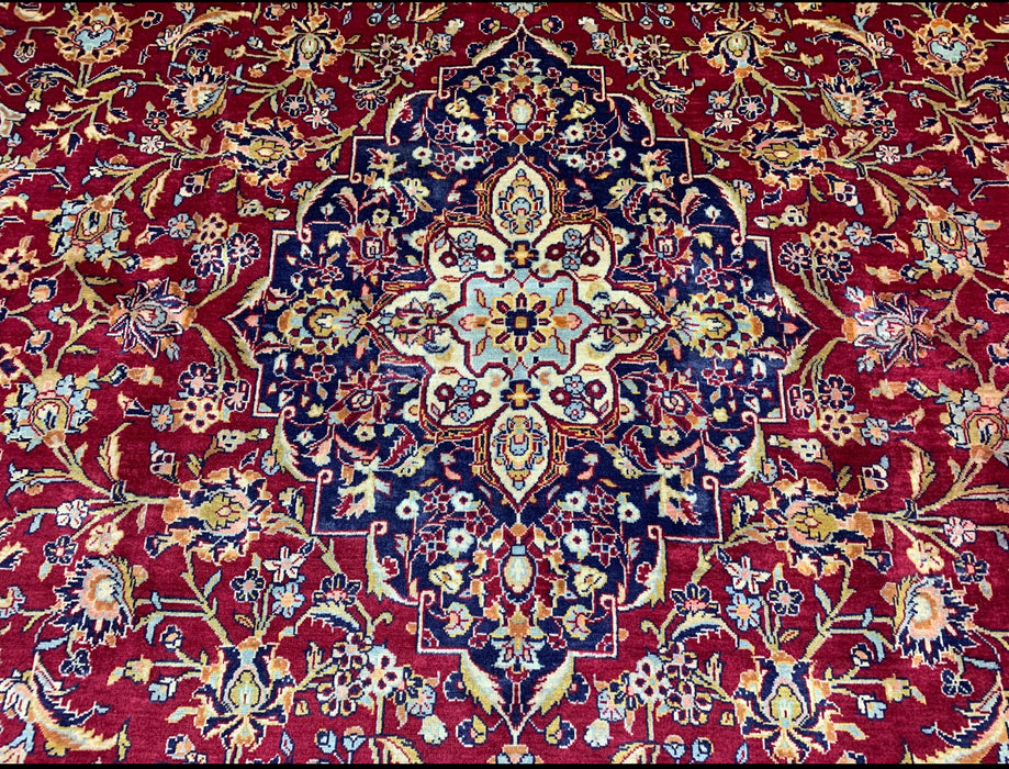 9’6” × 13’10” Hand-Knotted Persian Wool Rug – Red Field with Navy & Ivory Floral Border