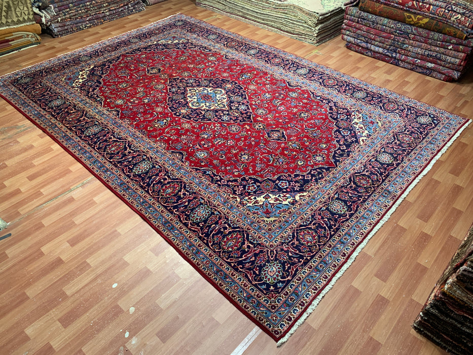 9’6” × 13’11” Hand-Knotted Wool Persian Rug – Red with Navy Border & Central Medallion