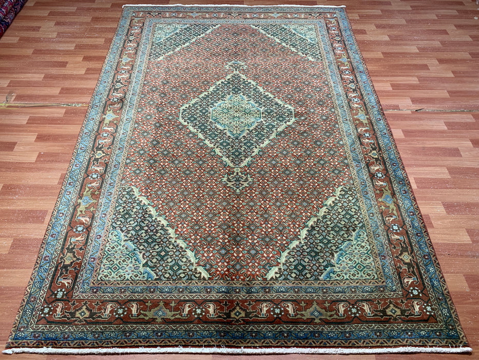 6’5” × 9’4” Hand-Knotted Wool Rug – Rust Red with Teal Diamond Medallion & Animal Border