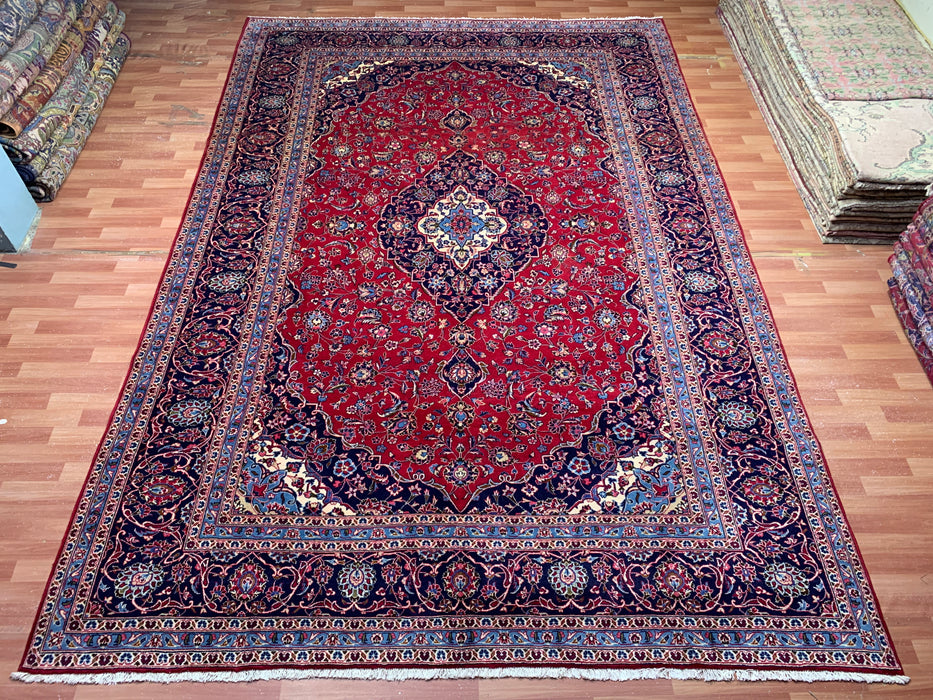 9’6” × 13’11” Hand-Knotted Wool Persian Rug – Red with Navy Border & Central Medallion