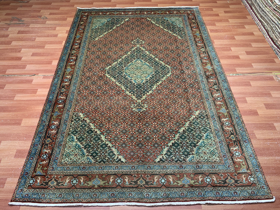 6’5” × 9’4” Hand-Knotted Wool Rug – Rust Red with Teal Diamond Medallion & Animal Border